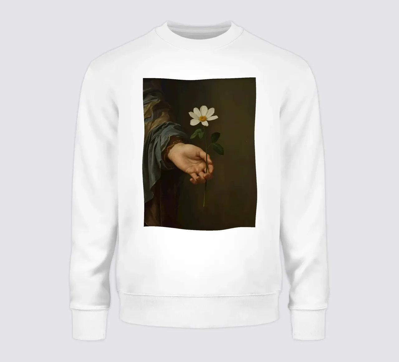 Main tenant une fleur blanche dans une lumière douce et atténuée. sweat de DesignDoodle