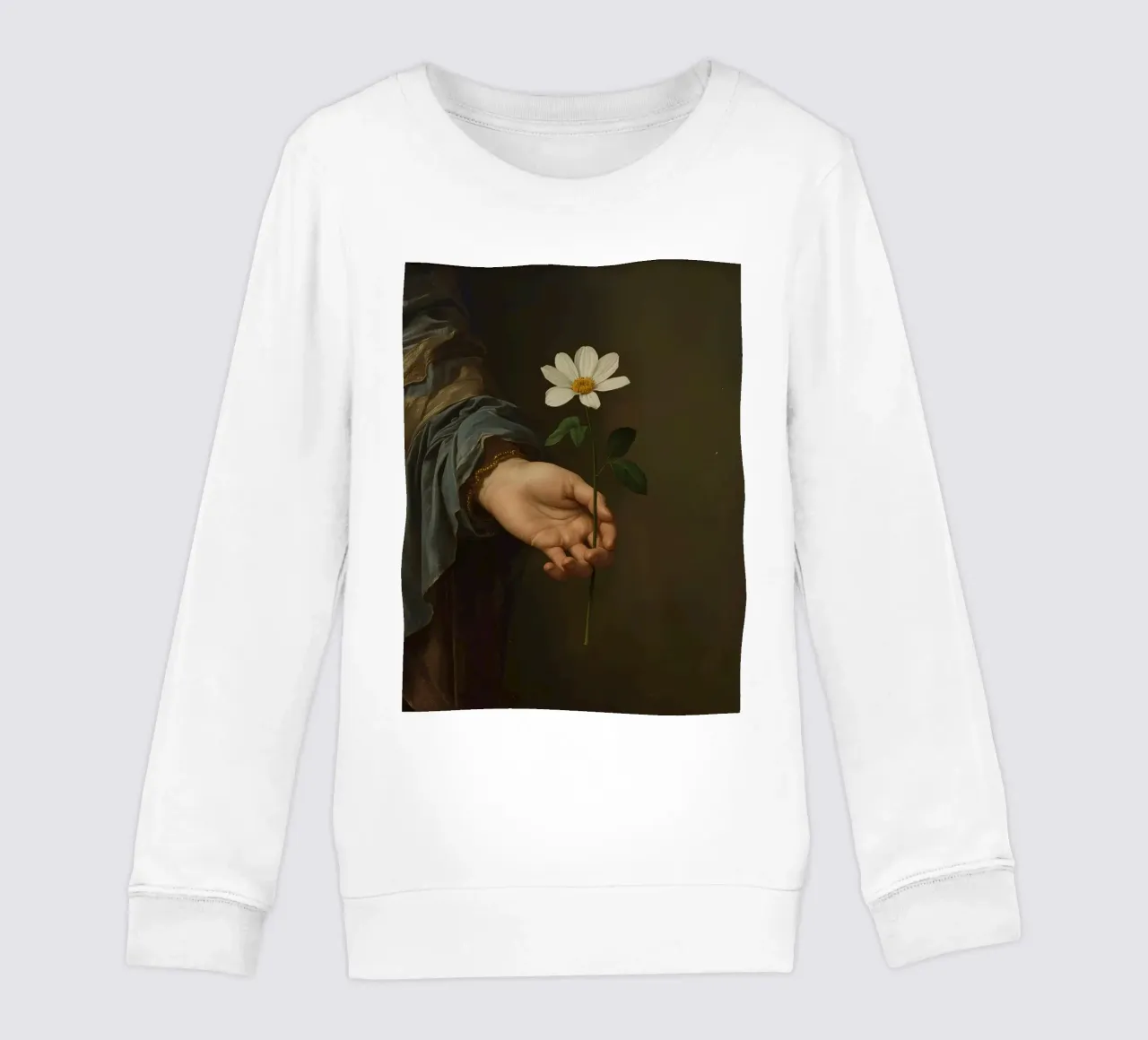 Mano che regge un fiore bianco in una luce soffusa con felpa bambino da DesignDoodle