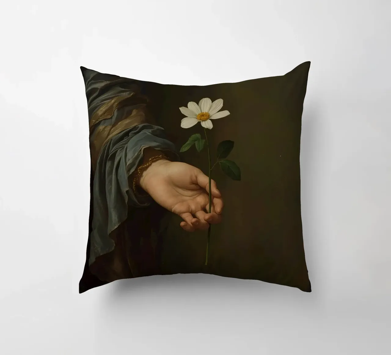 Mano che regge un fiore bianco in una luce soffusa con cuscino da DesignDoodle