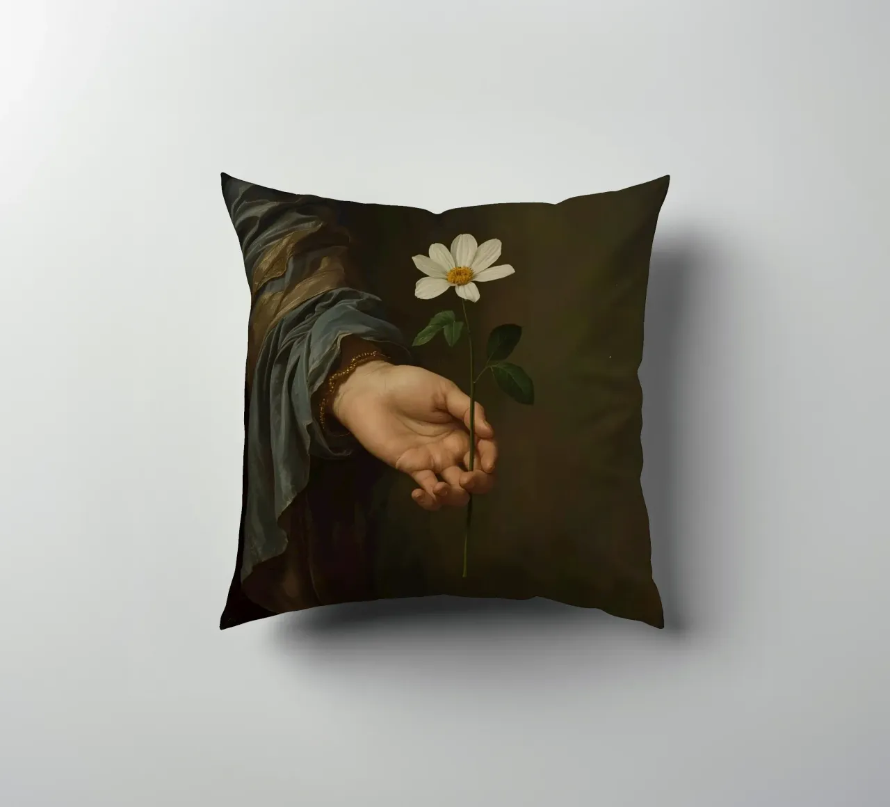 Mano che regge un fiore bianco in una luce soffusa con cuscino da DesignDoodle