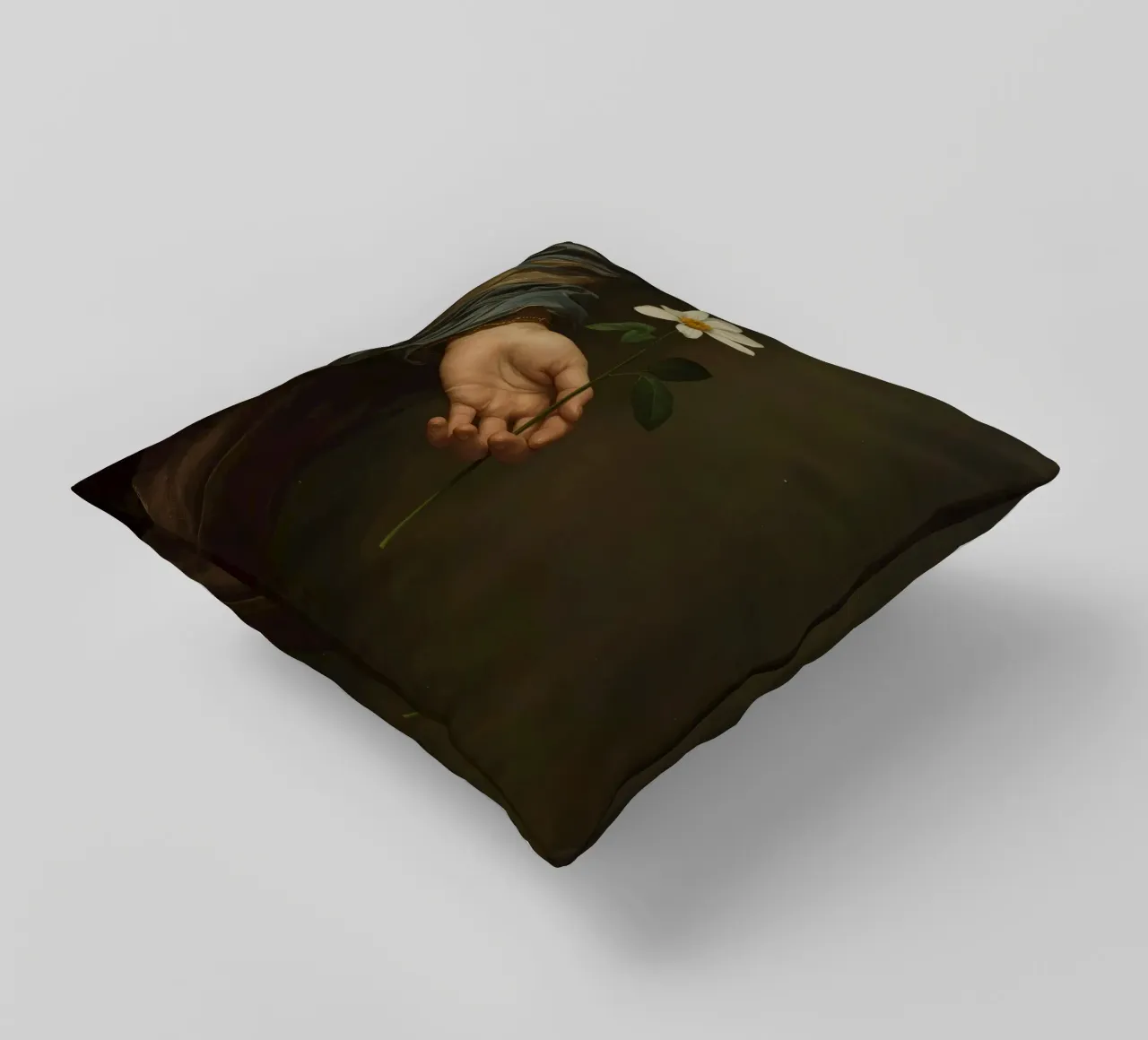 Mano che regge un fiore bianco in una luce soffusa con cuscino da DesignDoodle