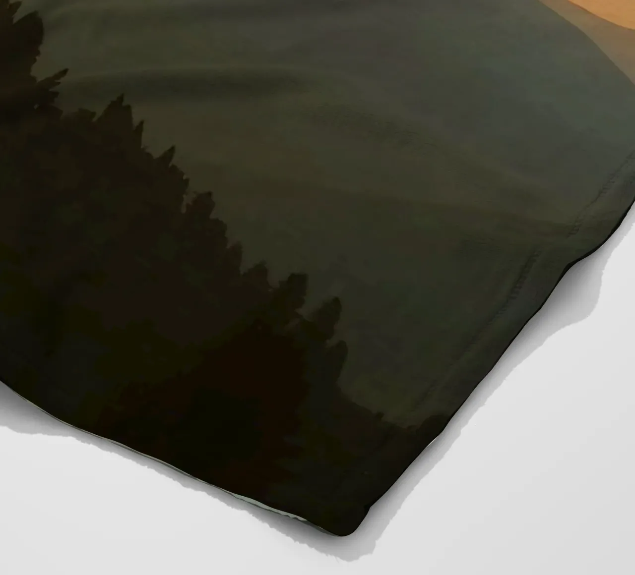 Sunset casting shadows over mountains and pine trees fleece blanket by DesignDoodle