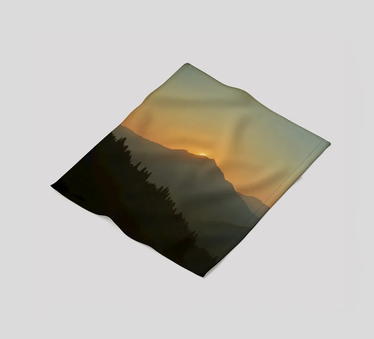 Sunset casting shadows over mountains and pine trees fleece blanket by DesignDoodle
