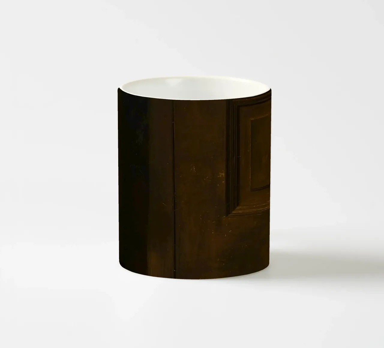 Doorway with black shoes resting on a concrete step under so ceramic mug by DesignDoodle