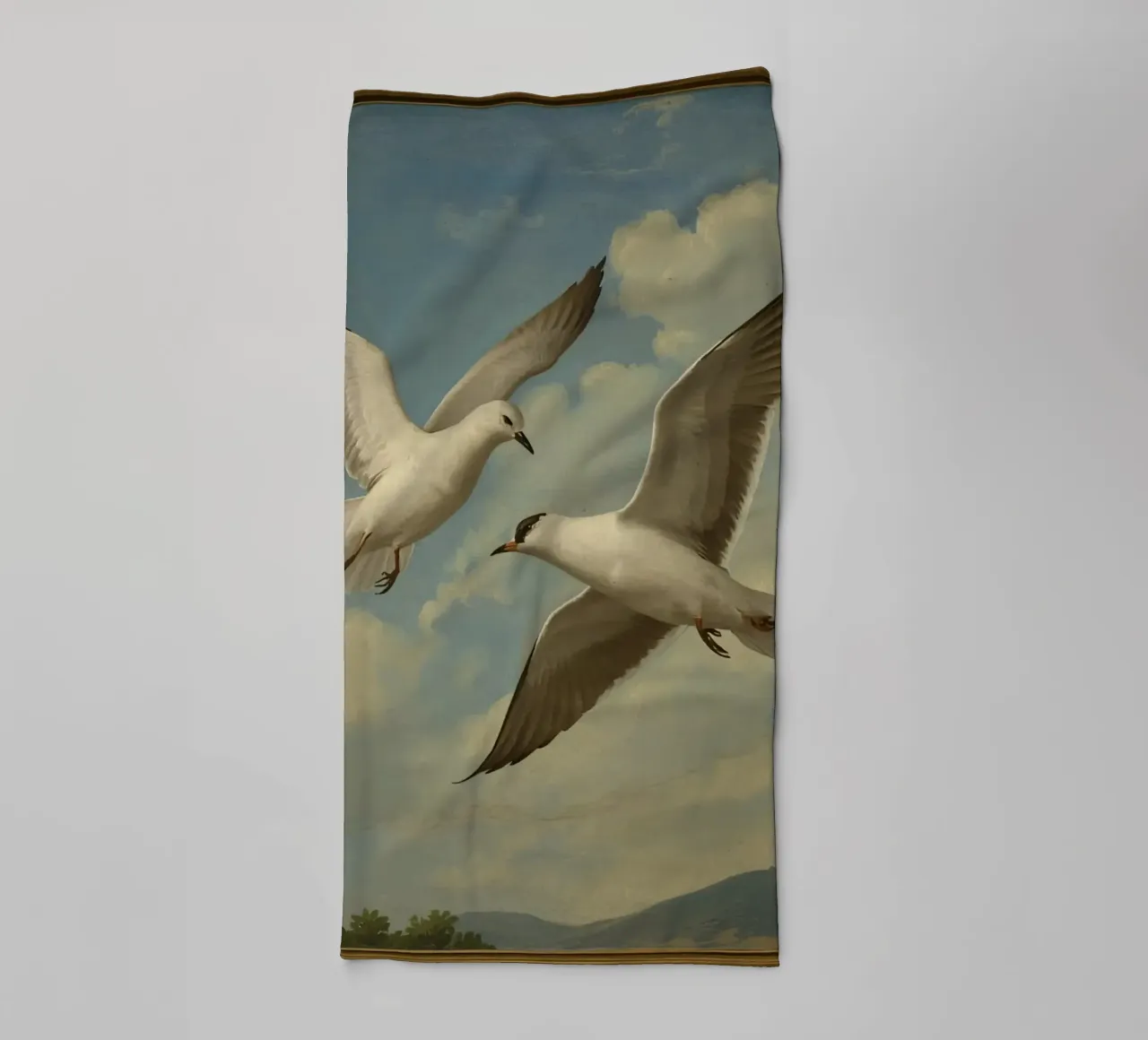 Two seagulls in mid-flight against a backdrop of clouds towel by DesignDoodle