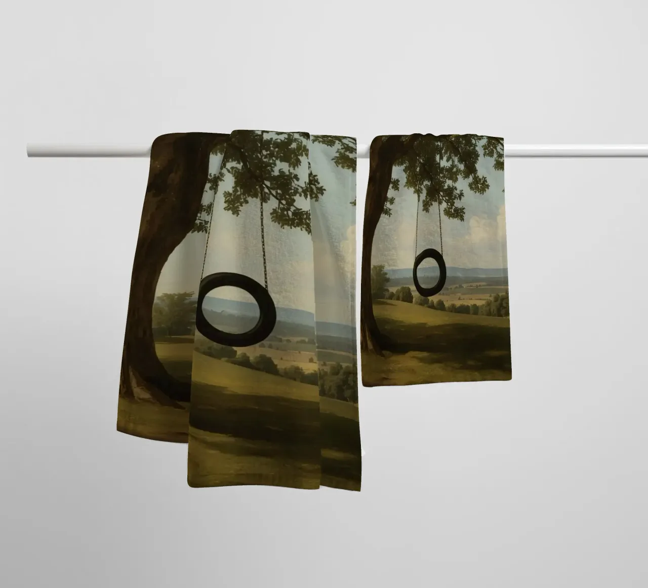 Tire swing hangs from an oak tree overlooking a grassy lands towel by DesignDoodle