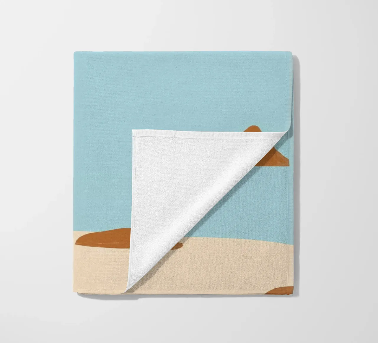 Rocky coast beach towel by Katinka Reinke