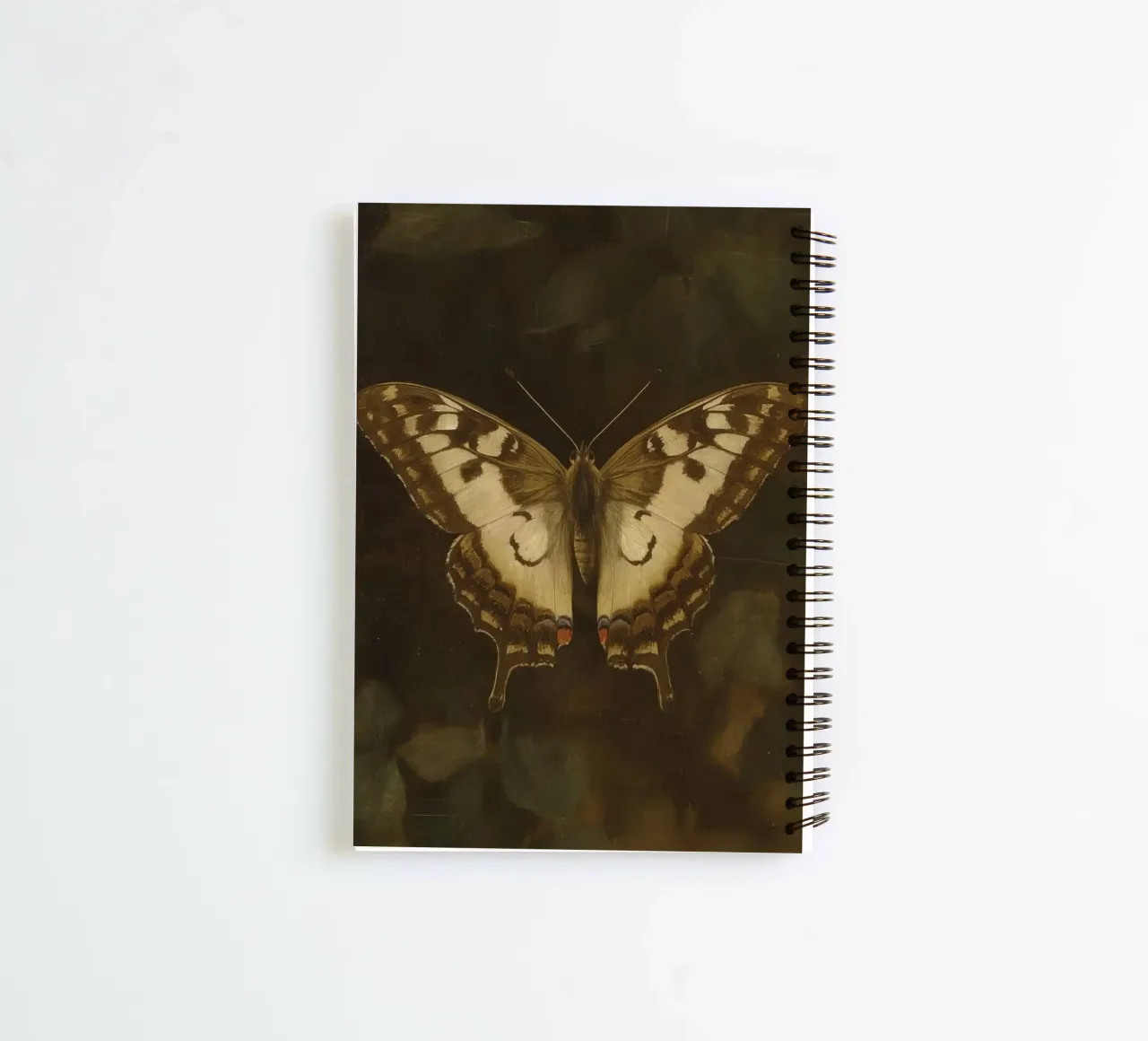 Butterfly resting on dark foliage with intricate patterns spiral notebook by DesignDoodle