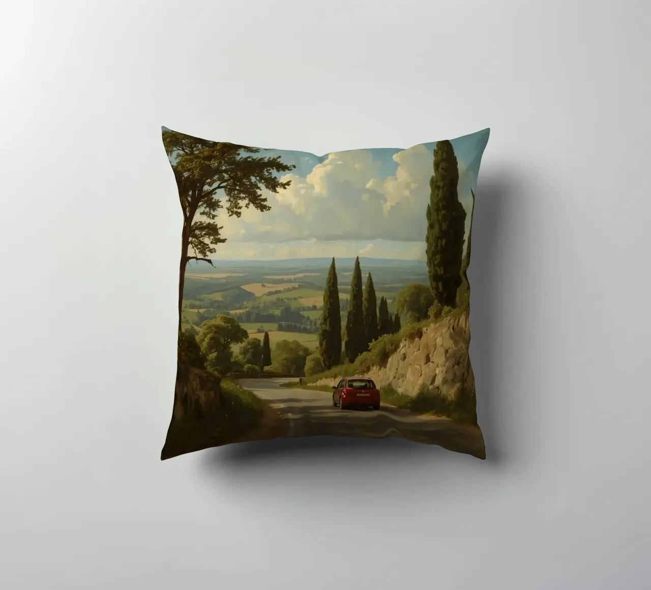 Superbe vue de la campagne avec une voiture roulant le long d'une route sinueuse. coussin de DesignDoodle
