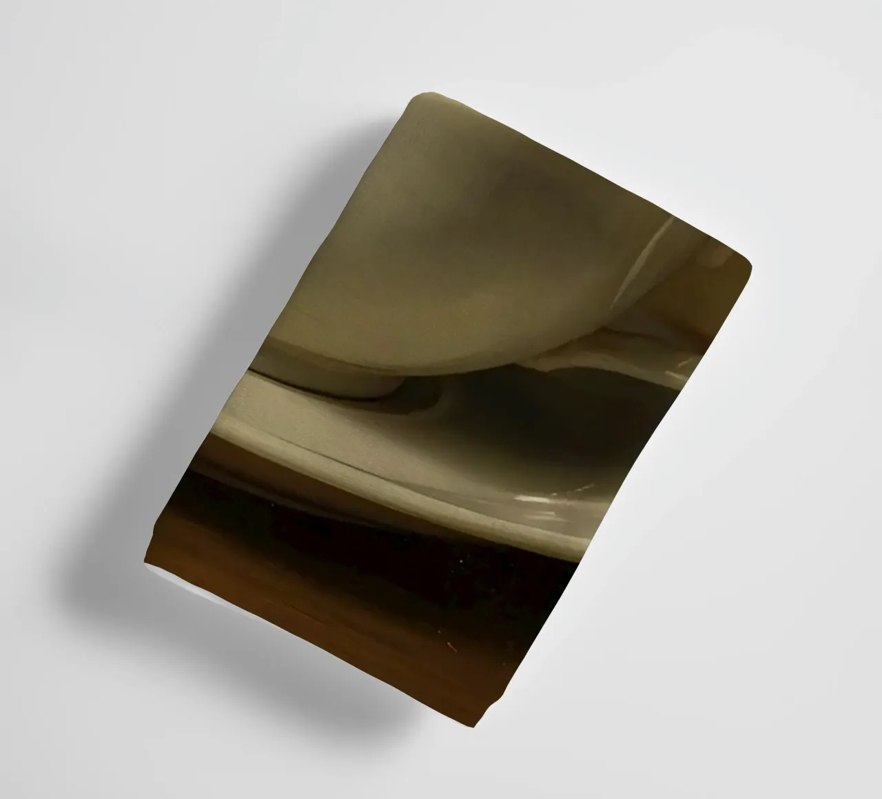 Coffee cup with steam resting on a saucer in a warm setting towel by DesignDoodle