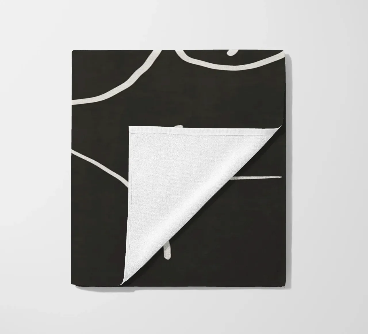 Model in black beach towel by Little Dean