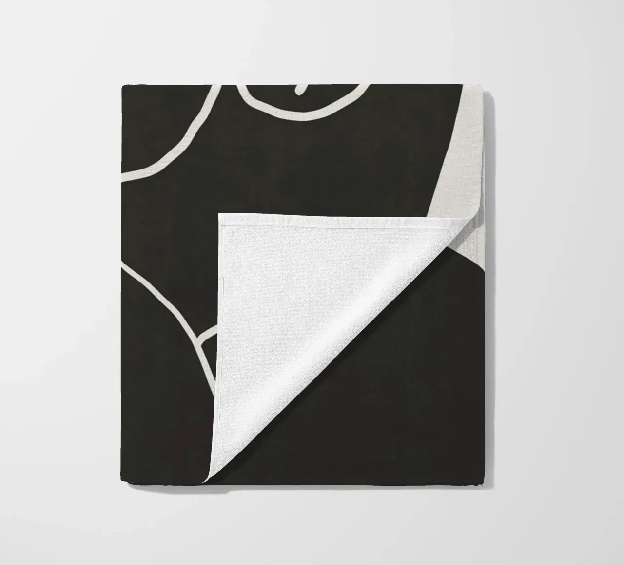 Model in black beach towel by Little Dean