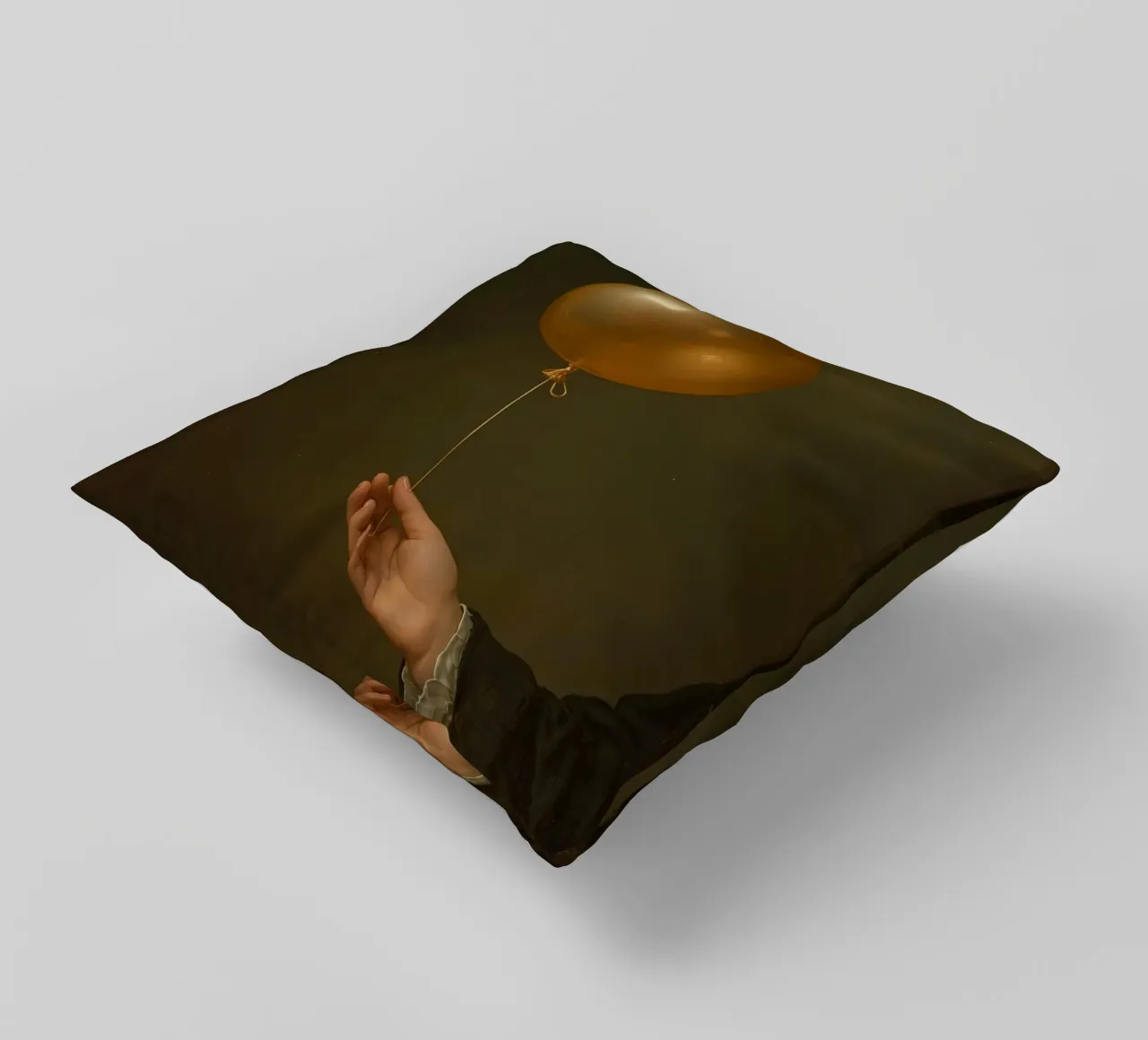 Pallone d'oro tenuto da una mano su uno sfondo scuro cuscino da DesignDoodle
