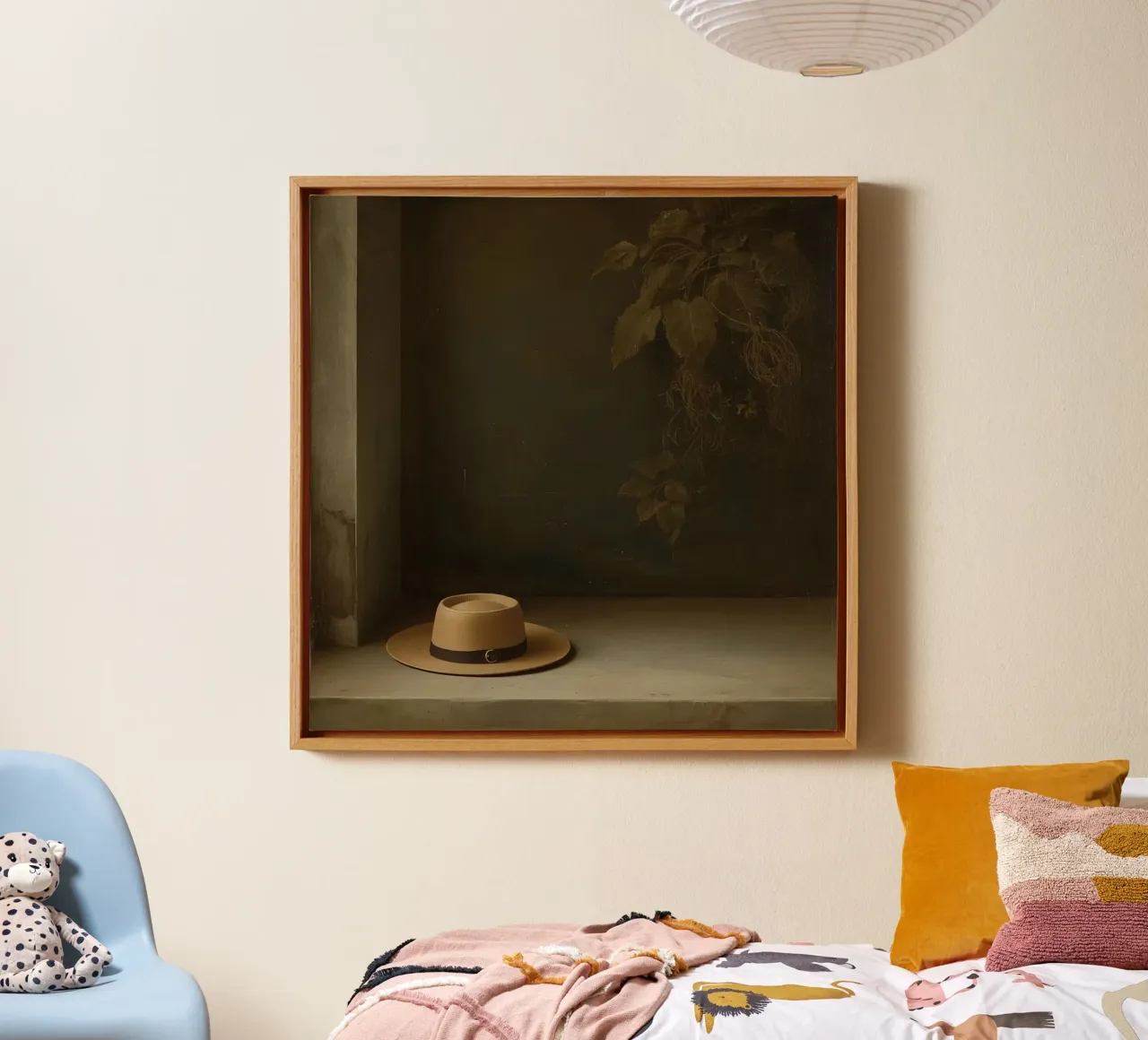 Hat resting on a surface with leaves in a muted setting canvas with Floater frame by DesignDoodle