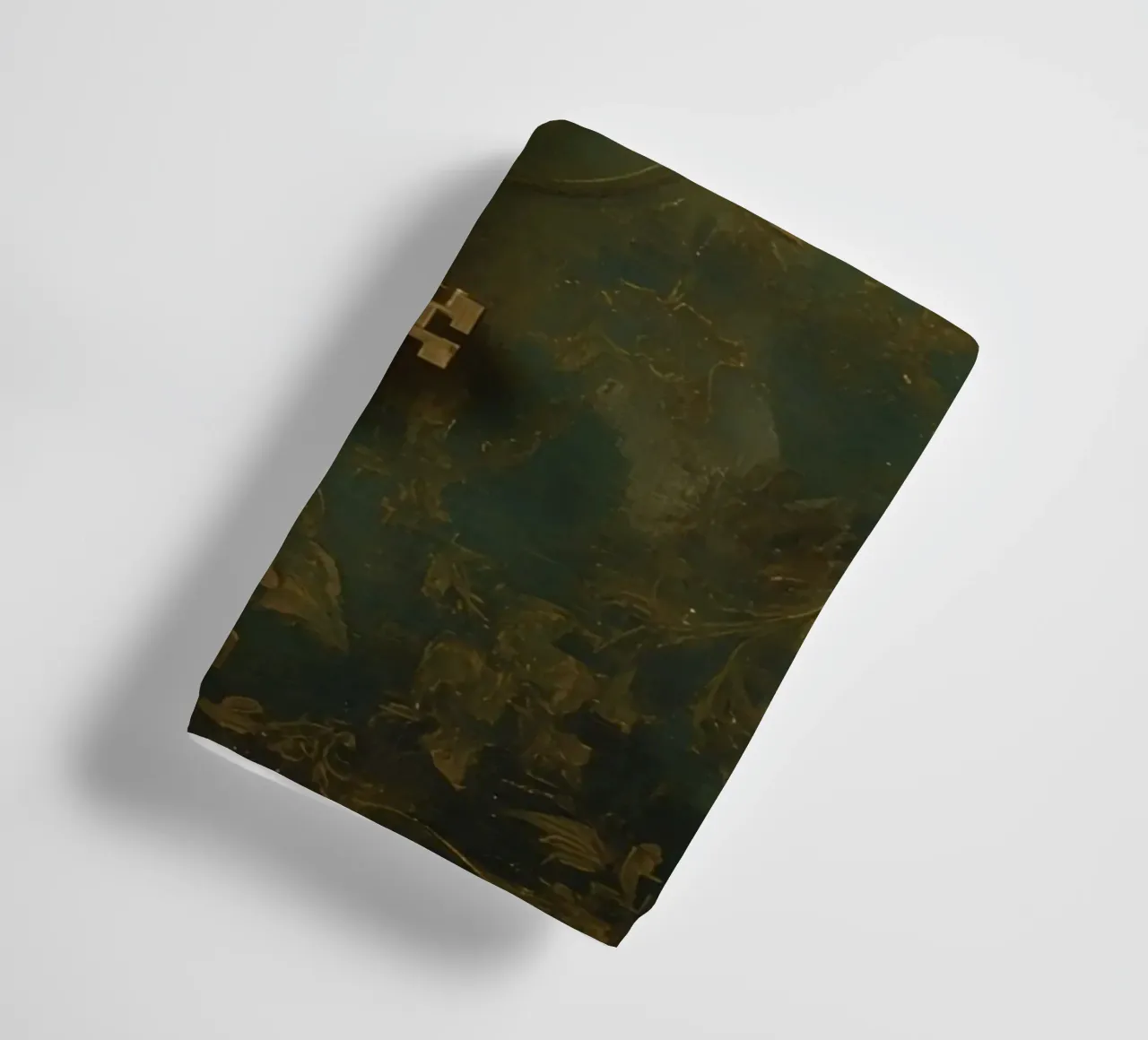 Key hanging against a textured background with intricate flo towel by DesignDoodle