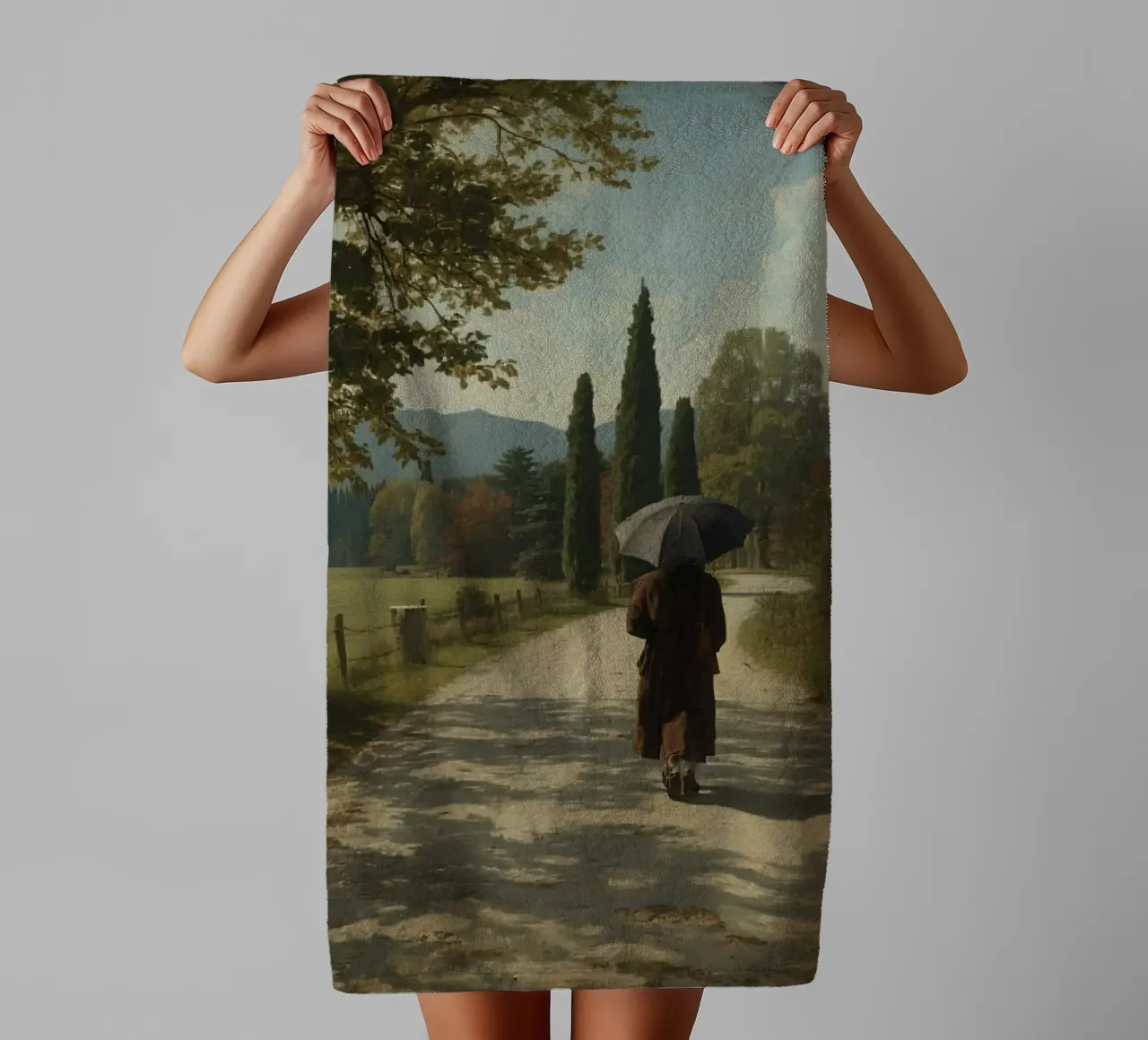 man walks along peaceful dirt path surrounded by tall trees towel by DesignDoodle