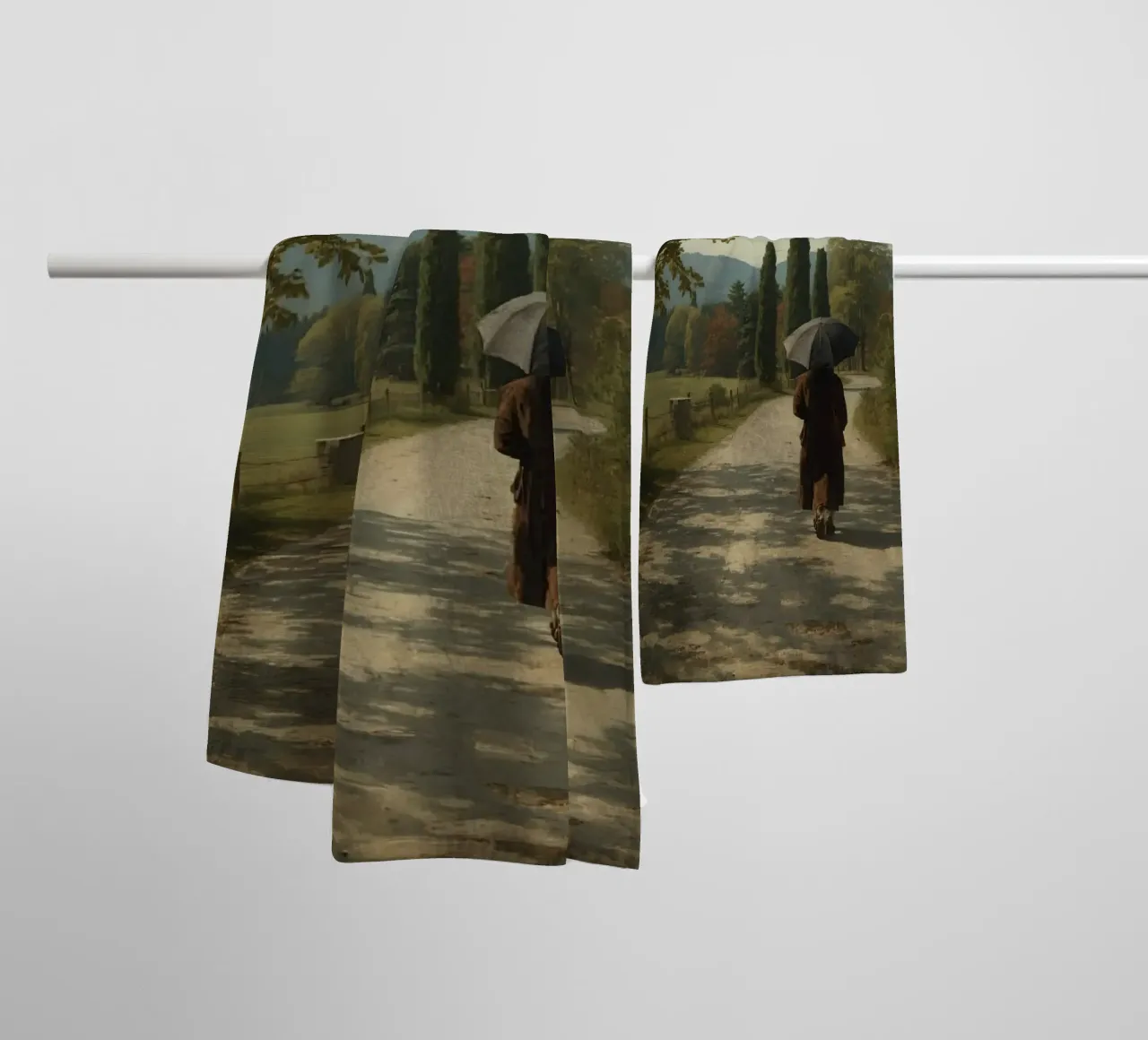 man walks along peaceful dirt path surrounded by tall trees towel by DesignDoodle