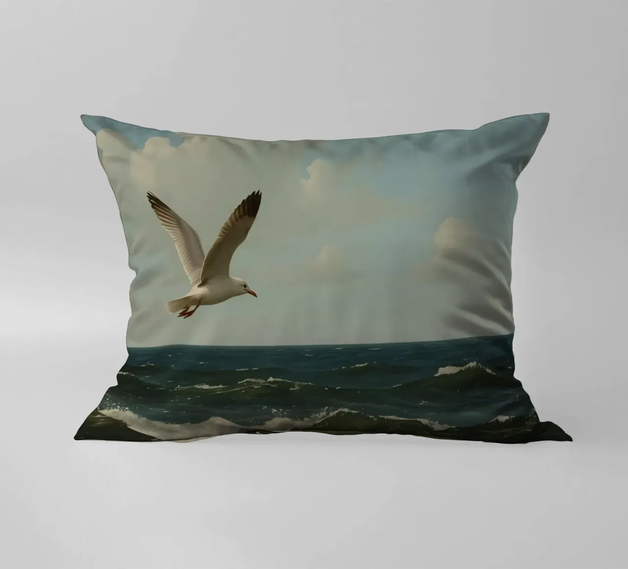 Seagull gliding over ocean waves under a partly cloudy sky decorative cushion by DesignDoodle