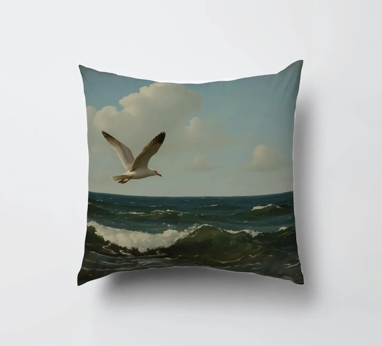 Seagull gliding over ocean waves under a partly cloudy sky decorative cushion by DesignDoodle