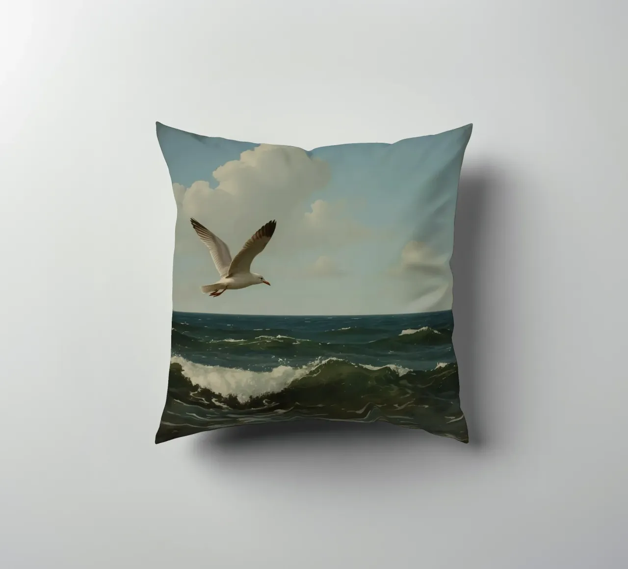 Seagull gliding over ocean waves under a partly cloudy sky decorative cushion by DesignDoodle