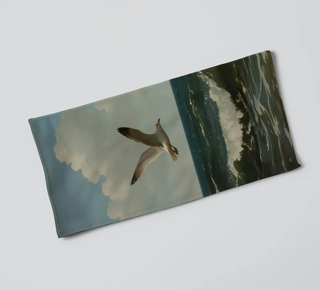 Seagull gliding over ocean waves under a partly cloudy sky towel by DesignDoodle