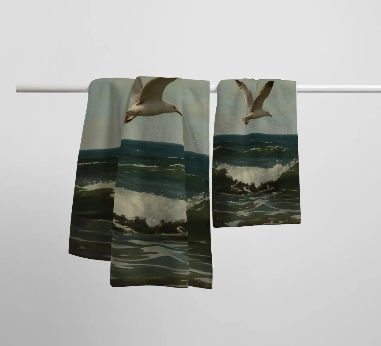 Seagull gliding over ocean waves under a partly cloudy sky towel by DesignDoodle