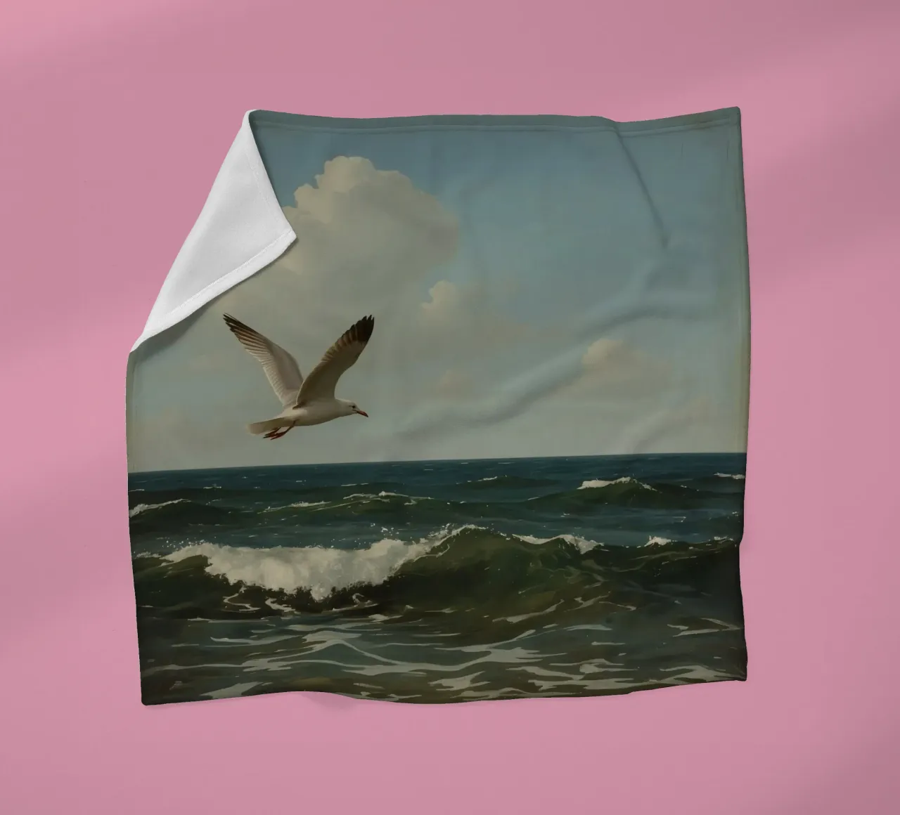 Seagull gliding over ocean waves under a partly cloudy sky fleece blanket by DesignDoodle