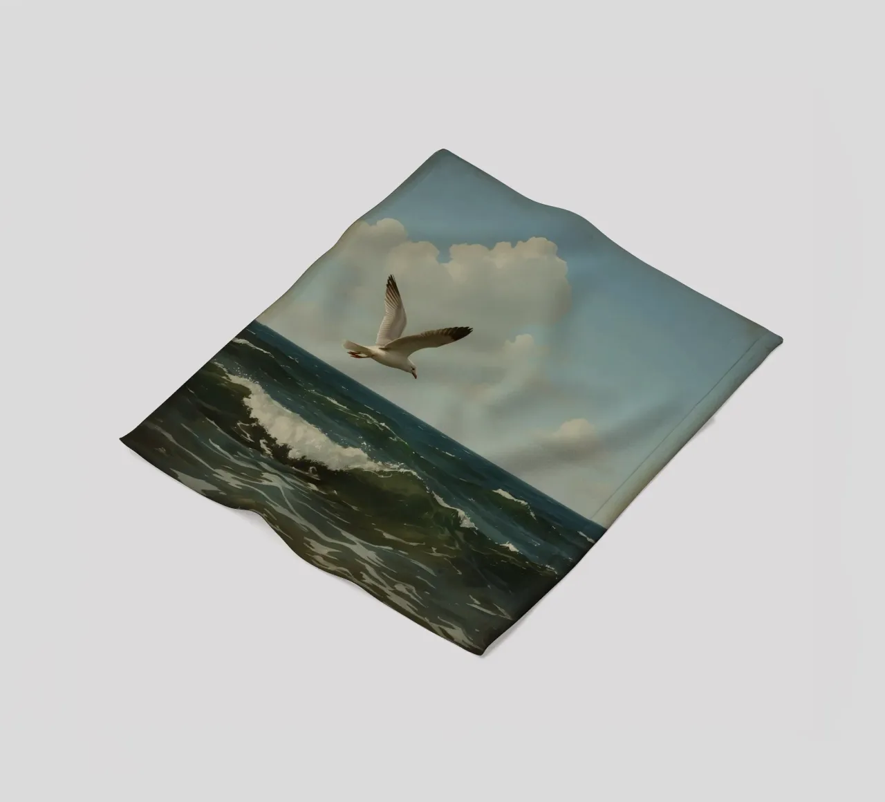 Seagull gliding over ocean waves under a partly cloudy sky fleece blanket by DesignDoodle