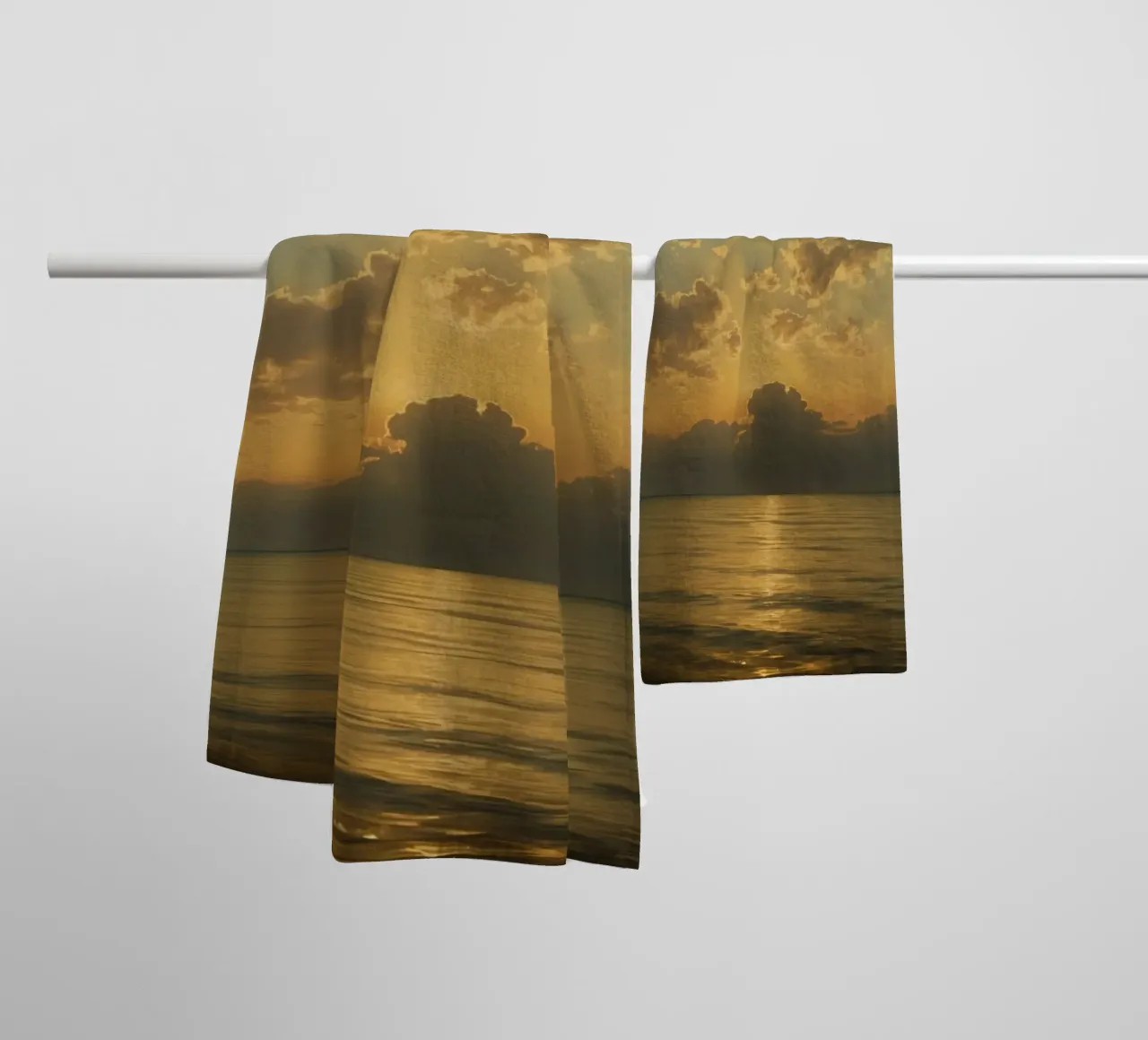 Sunset over calm waters with distant sailboat on the horizon towel by DesignDoodle
