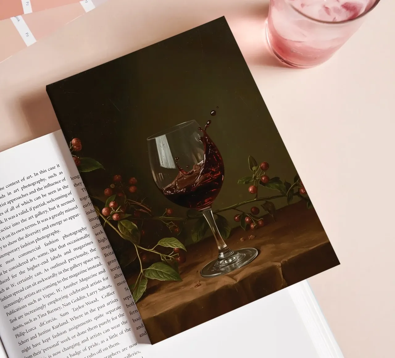 Red wine splashes in a glass surrounded by ripe berries notebook by DesignDoodle