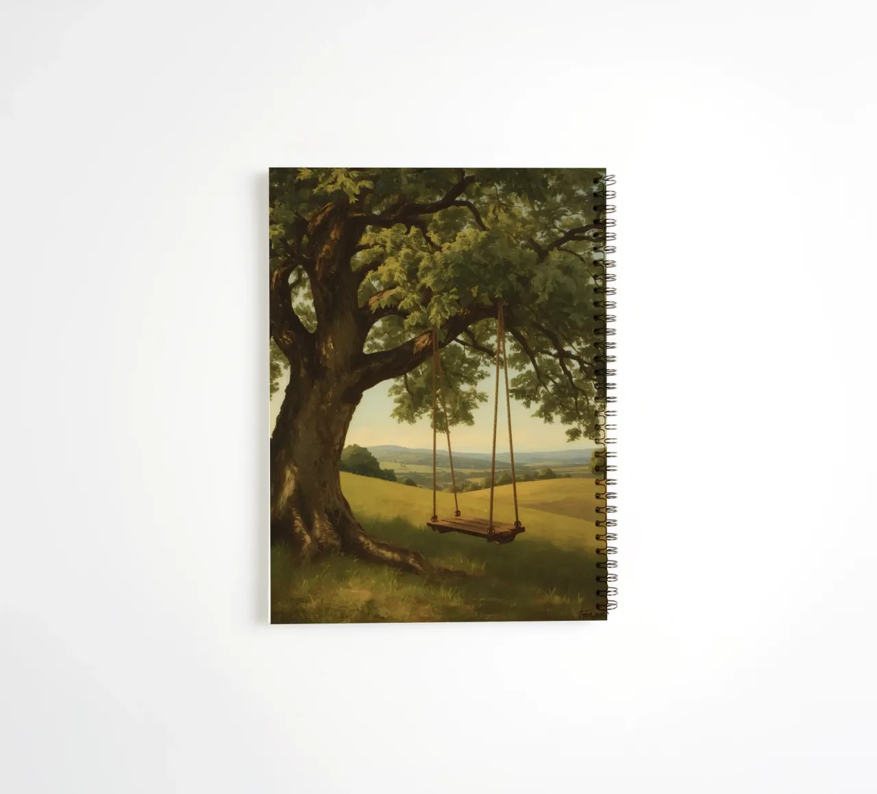 Swing hanging from a large tree overlooking rolling hills spiral notebook by DesignDoodle