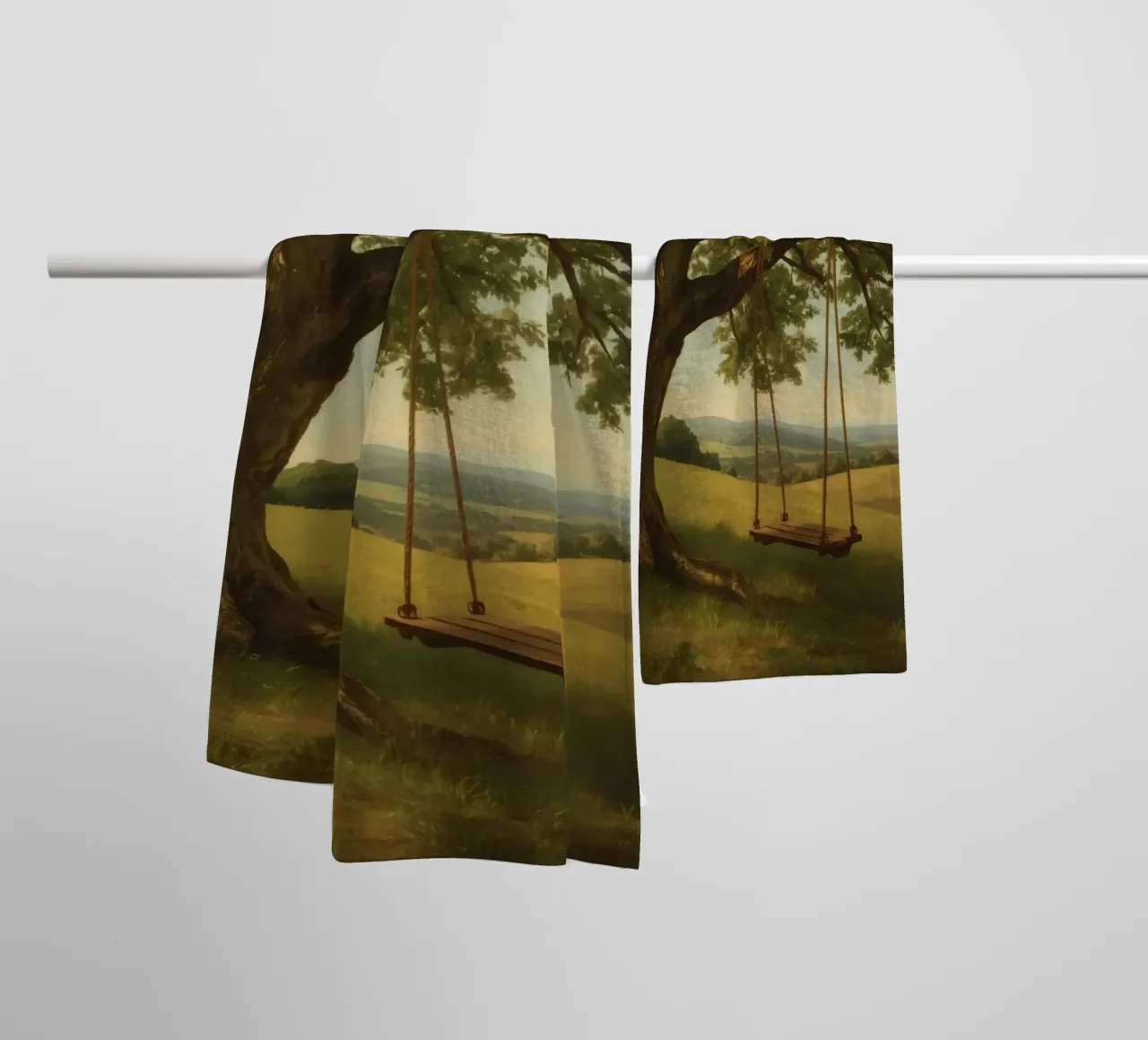 Swing hanging from a large tree overlooking rolling hills towel by DesignDoodle