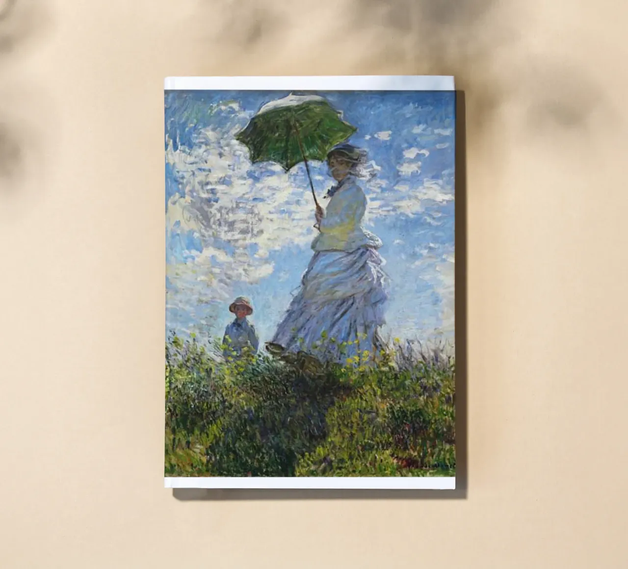 woman carrying an umbrella in the middle of the field notebook by SMG Store