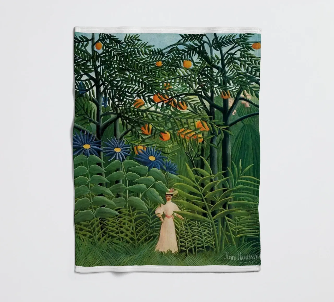 a woman who is enjoying God's creation fleece blanket by taylor shop