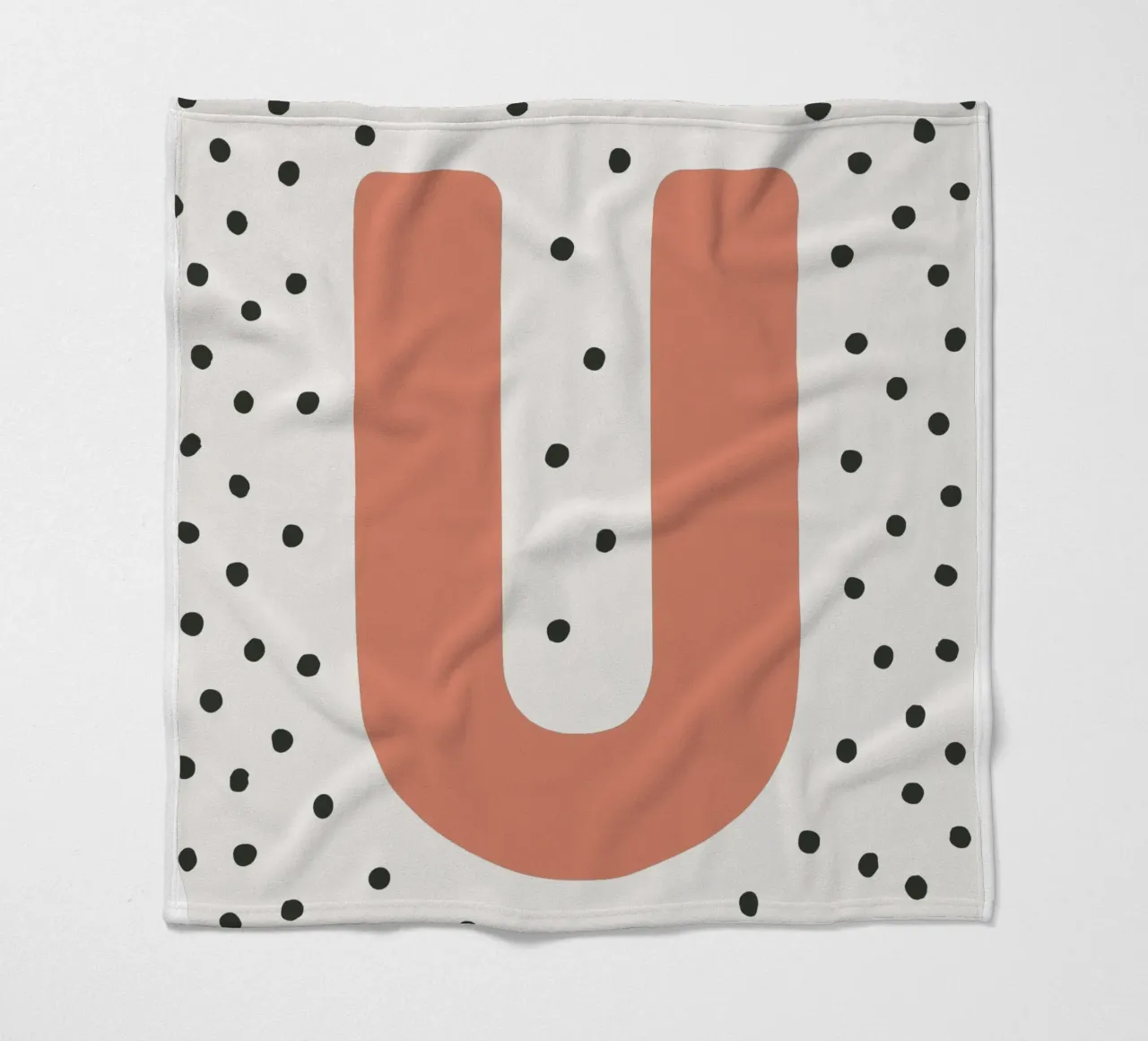 Initial U on dot pattern - Scandinavian style fleece blanket by KidzStudio