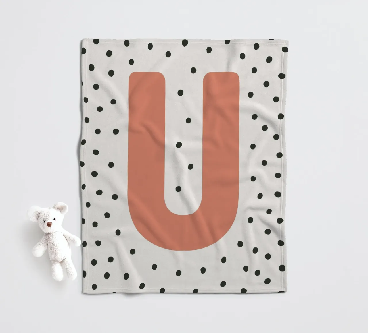 Initial U on dot pattern - Scandinavian style fleece blanket by KidzStudio