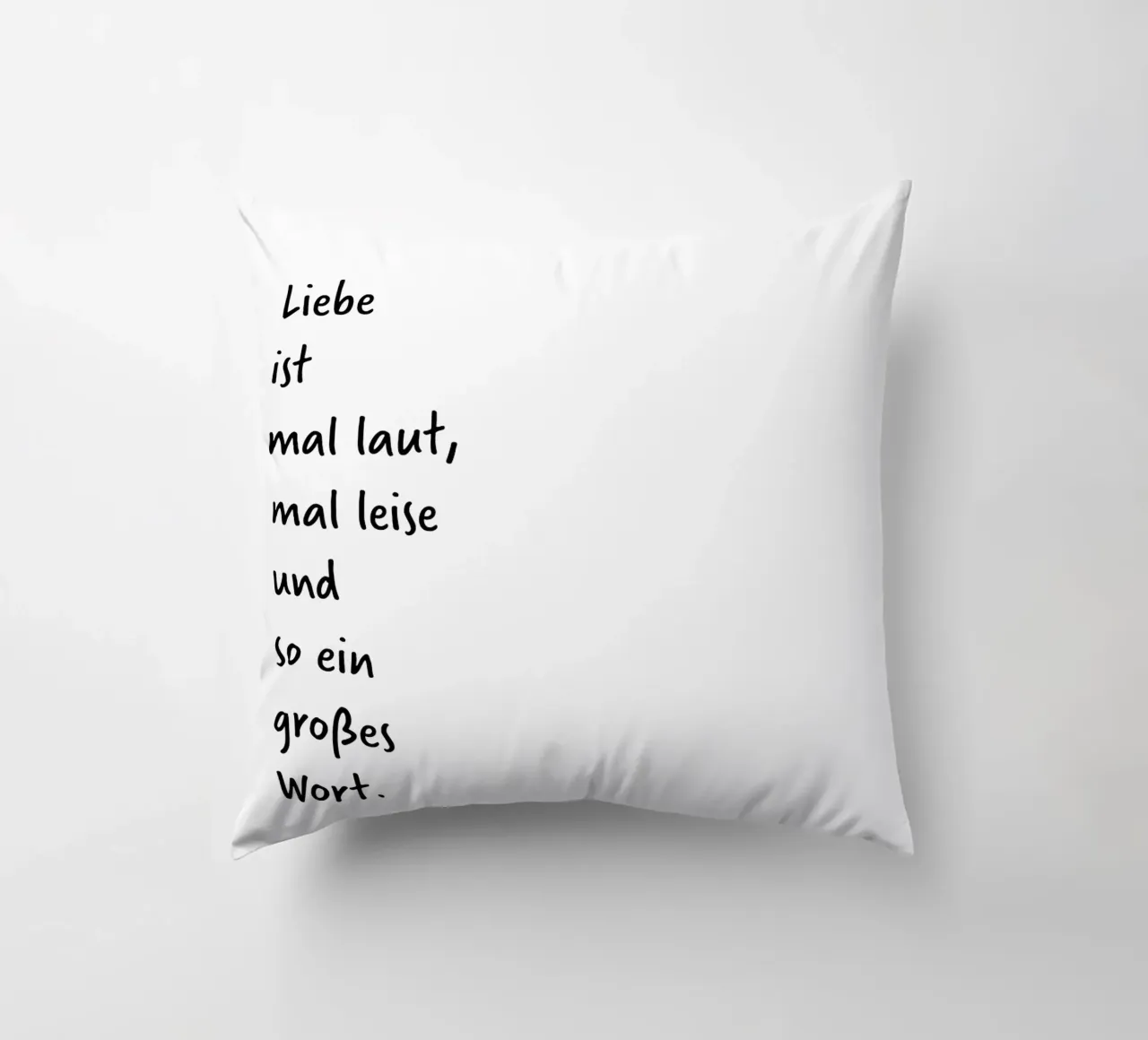 Liebe ist mal laut, mal leise und so ein großes Wort. decorative cushion by FRICKE DESIGN