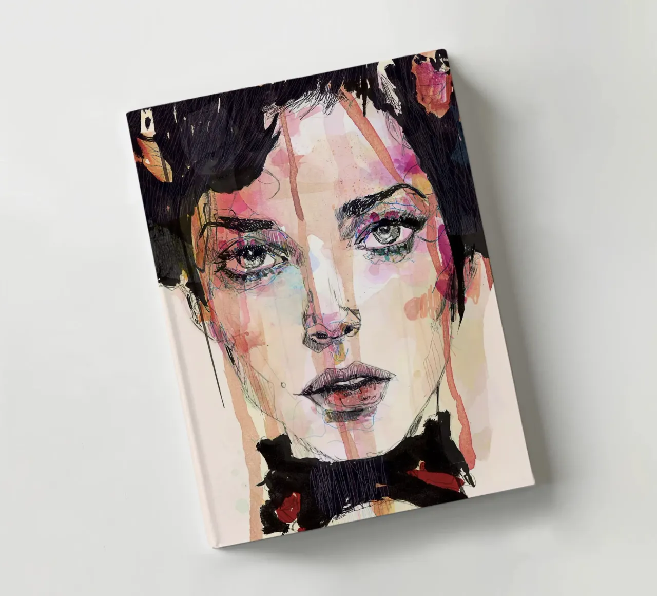 red and black notebook by Giulio Iurissevich