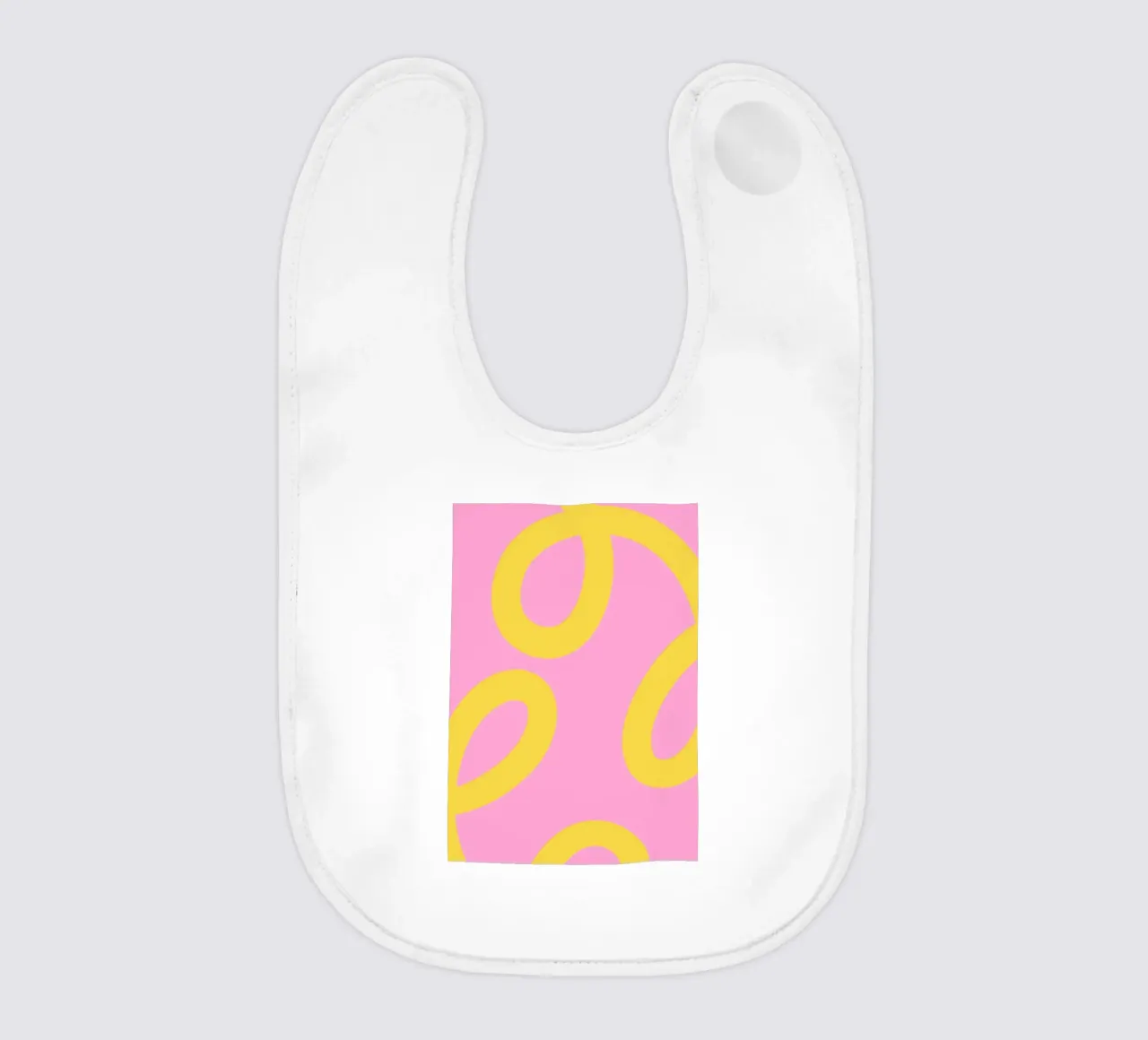 Motif ludique de tourbillons jaunes sur fond rose bavoir de The Art Club