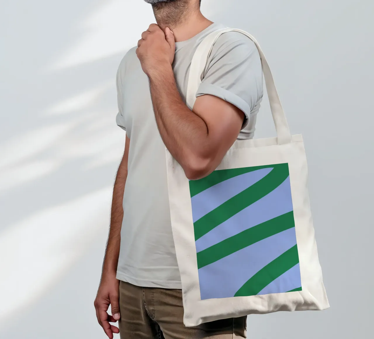 Abstract Green Waves on Soft Blue Background tote bag by The Art Club