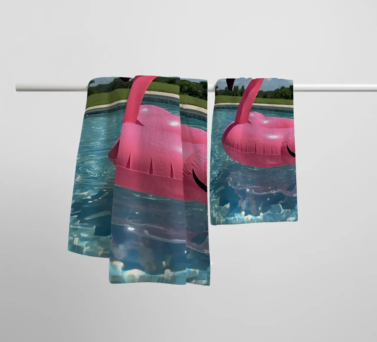 Pink Inflatable Flamingo Pool Float in Swimming Pool towel by DesignDoodle