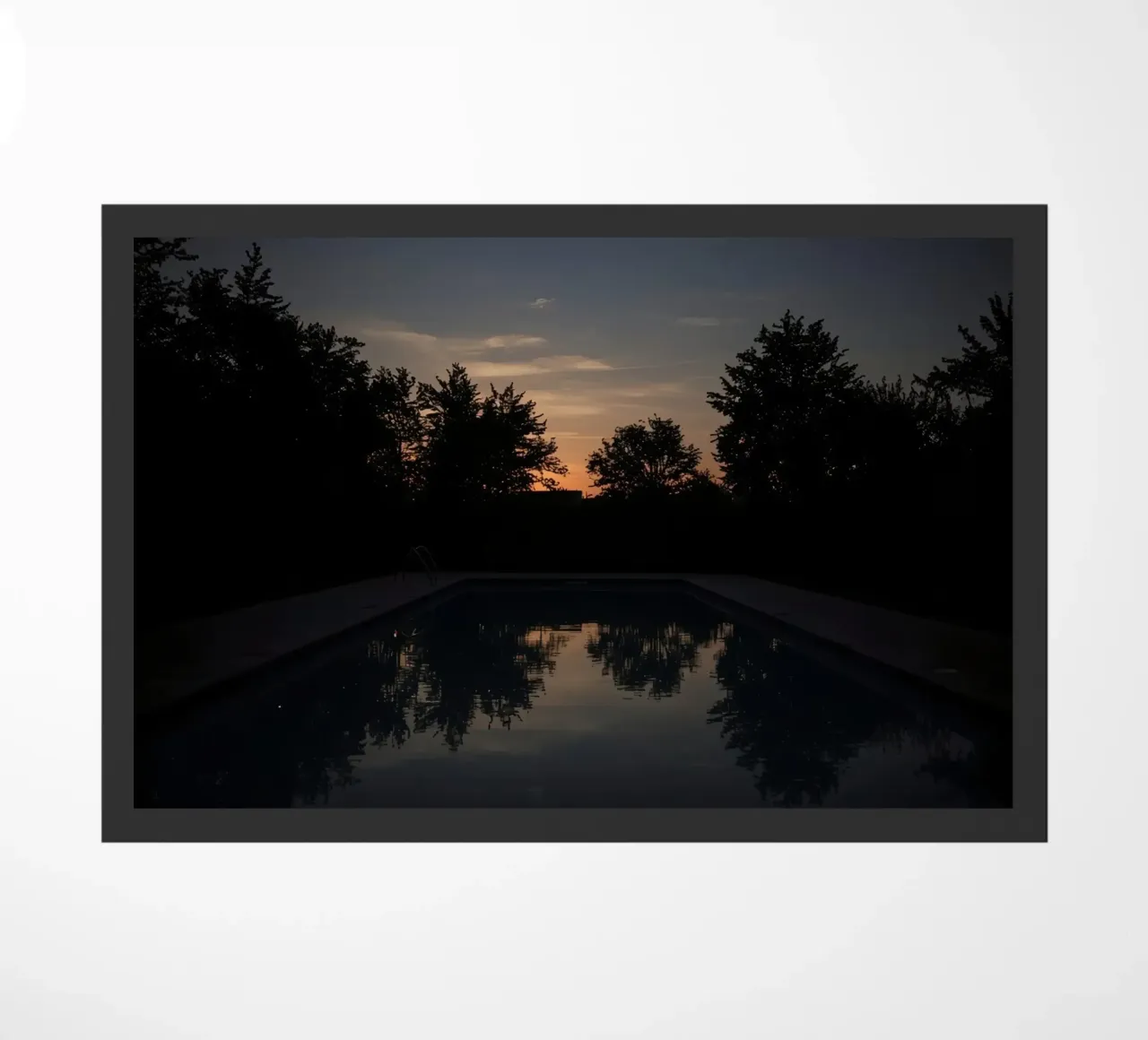 Swimming Pool at Dusk with Tree Reflections and Sunset Sky doormat by DesignDoodle