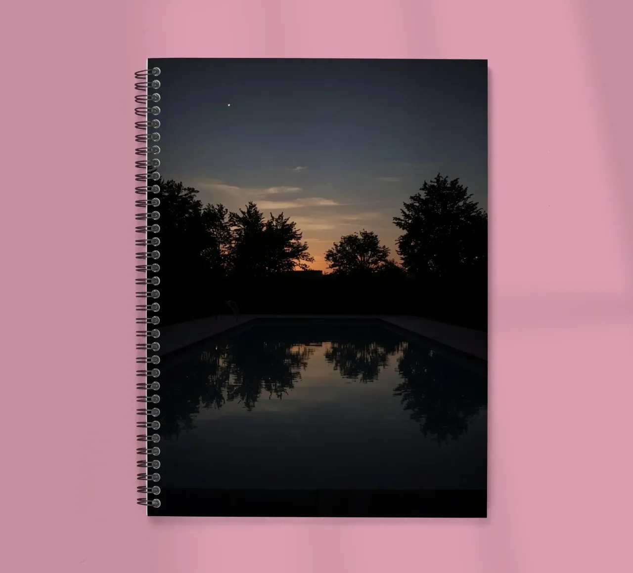 Swimming Pool at Dusk with Tree Reflections and Sunset Sky spiral notebook by DesignDoodle
