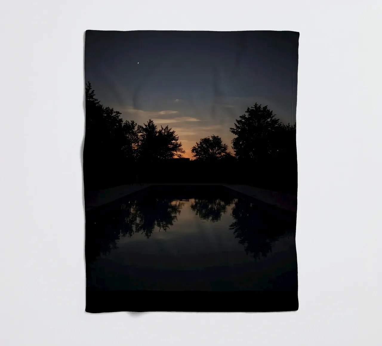 Swimming Pool at Dusk with Tree Reflections and Sunset Sky fleece blanket by DesignDoodle