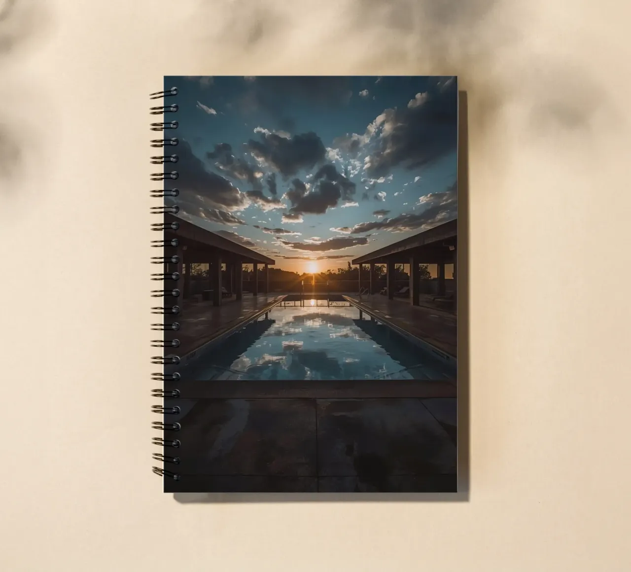 Swimming Pool Reflecting Sunset with Covered Structures spiral notebook by DesignDoodle