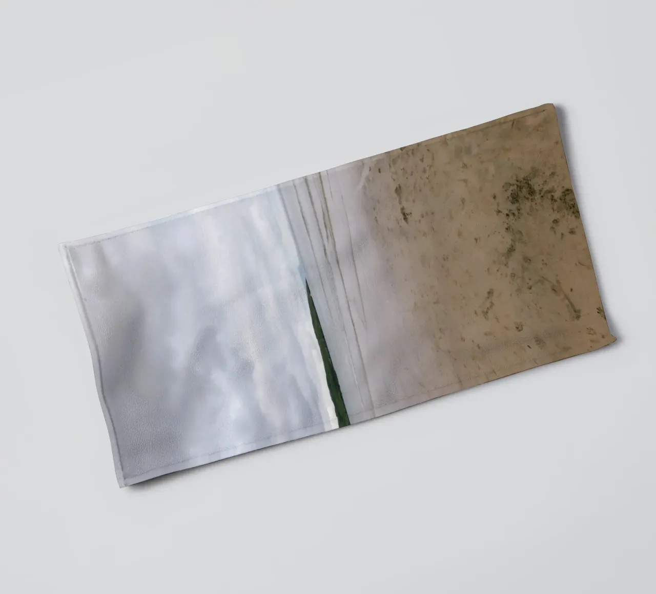 Silence on the tidal beach towel by The Wild Creative Studio