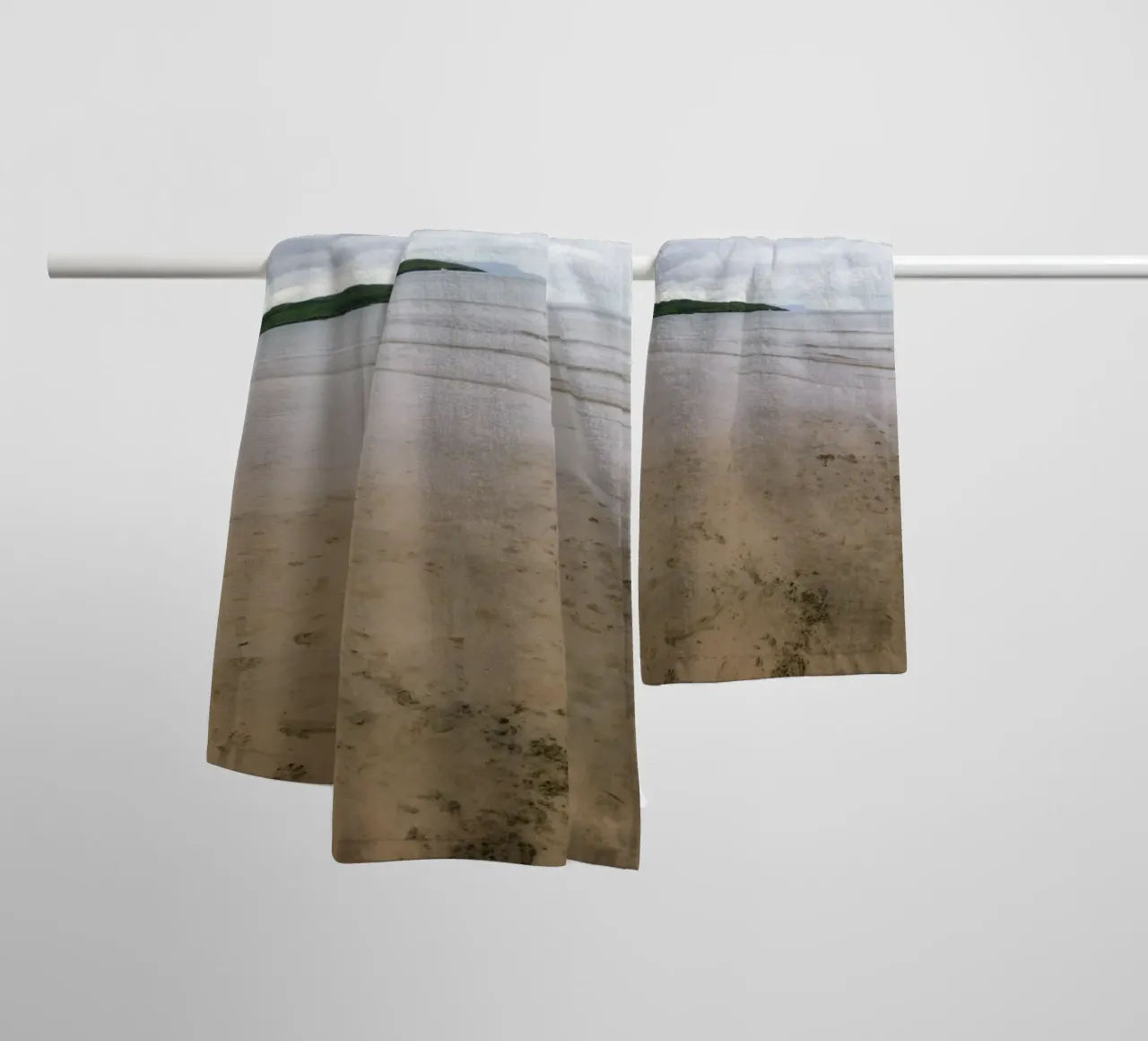 Silence on the tidal beach towel by The Wild Creative Studio