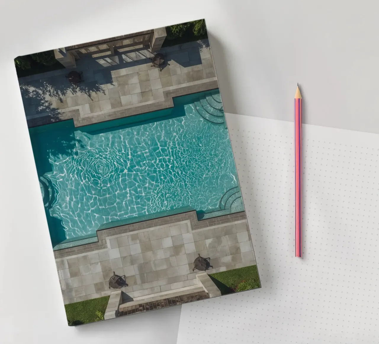 Aerial View of Rectangular Swimming Pool with Stone Patio notebook by DesignDoodle