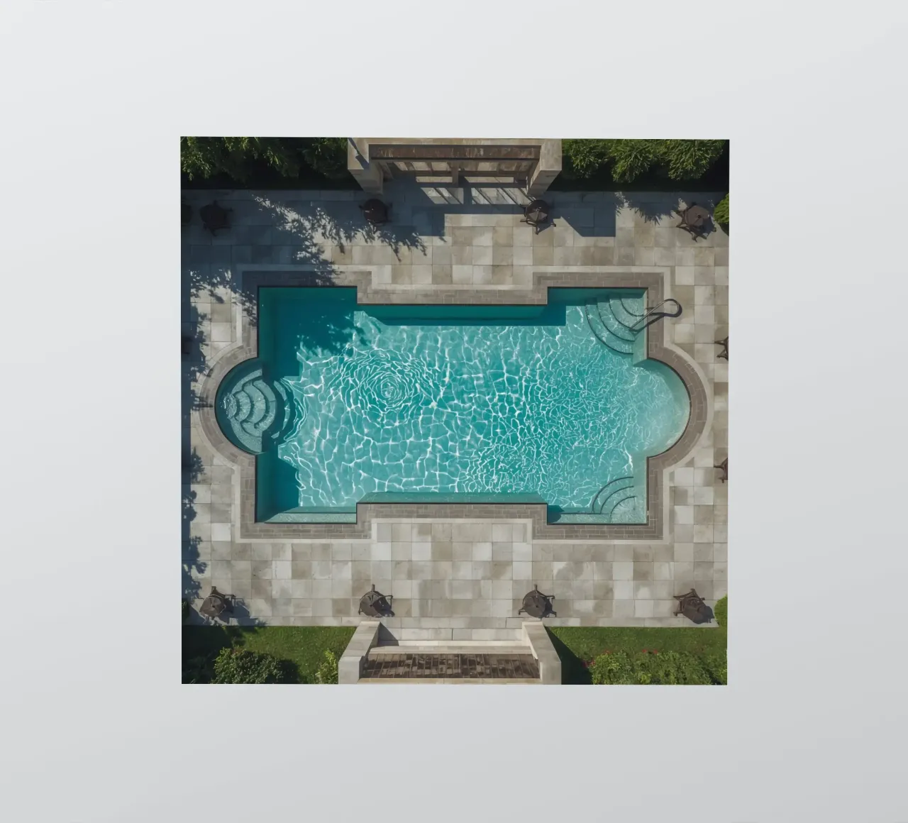 Vue aérienne d'une piscine rectangulaire avec un patio en pierre autocollant de DesignDoodle