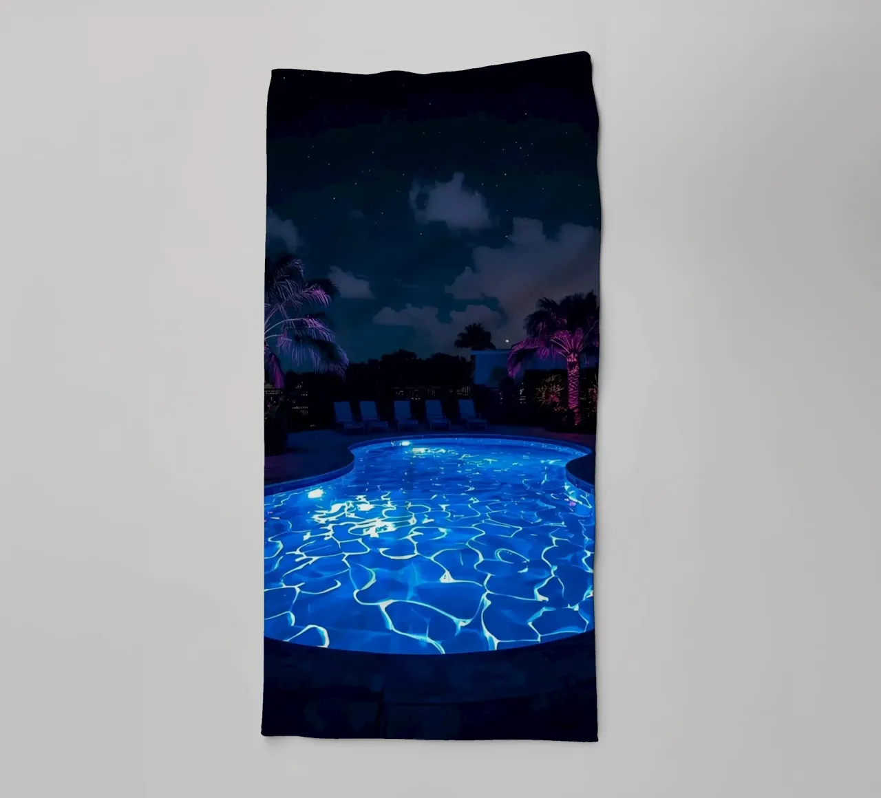 Illuminated Swimming Pool at Night with Palm Trees towel by DesignDoodle